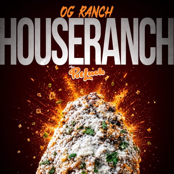 A mound of food, possibly a casserole, with melted cheese and green herbs, exploding with fiery sparks.