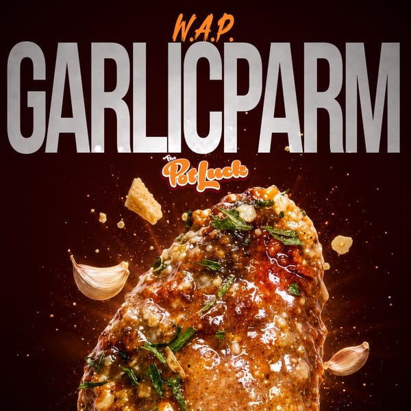 Garlic Parm chicken wing from The Potluck, with garlic cloves and parmesan cheese floating around it.